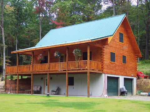 Custom log home with a covered porch and walkout lower level