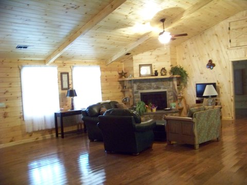 Living room with a stone fireplace